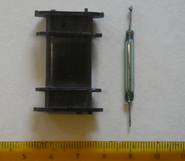glass tube reed switch, plastic bobbin and metric scale