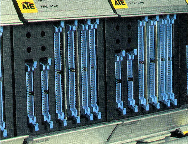photograph modules plugged into equipment rack with insulation displacement connectors on the front face