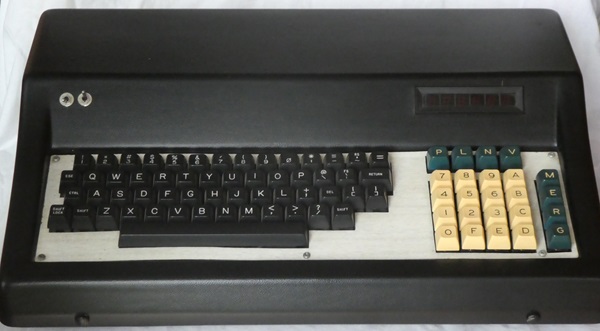 alphanumeric keyboard mounted in sloping top black vinyl case