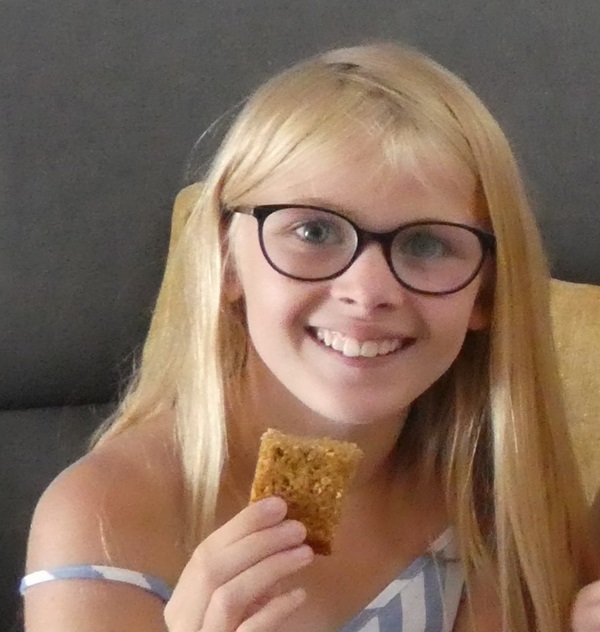 young girl holding flapjackr